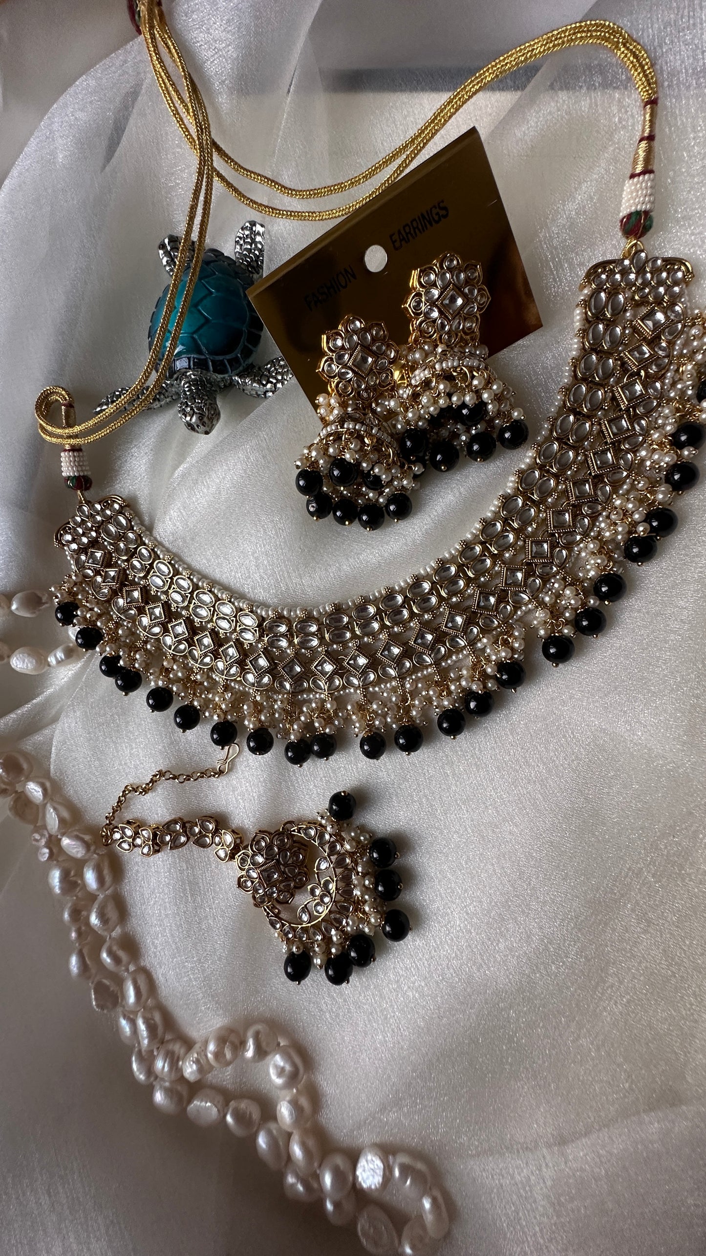 Kundan choker or necklace set with earrings and tikka black