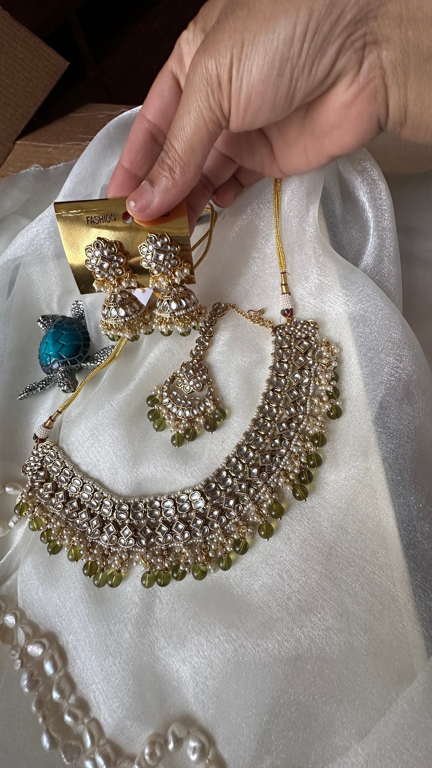 Kundan choker or necklace set with earrings and tikka mehndi green