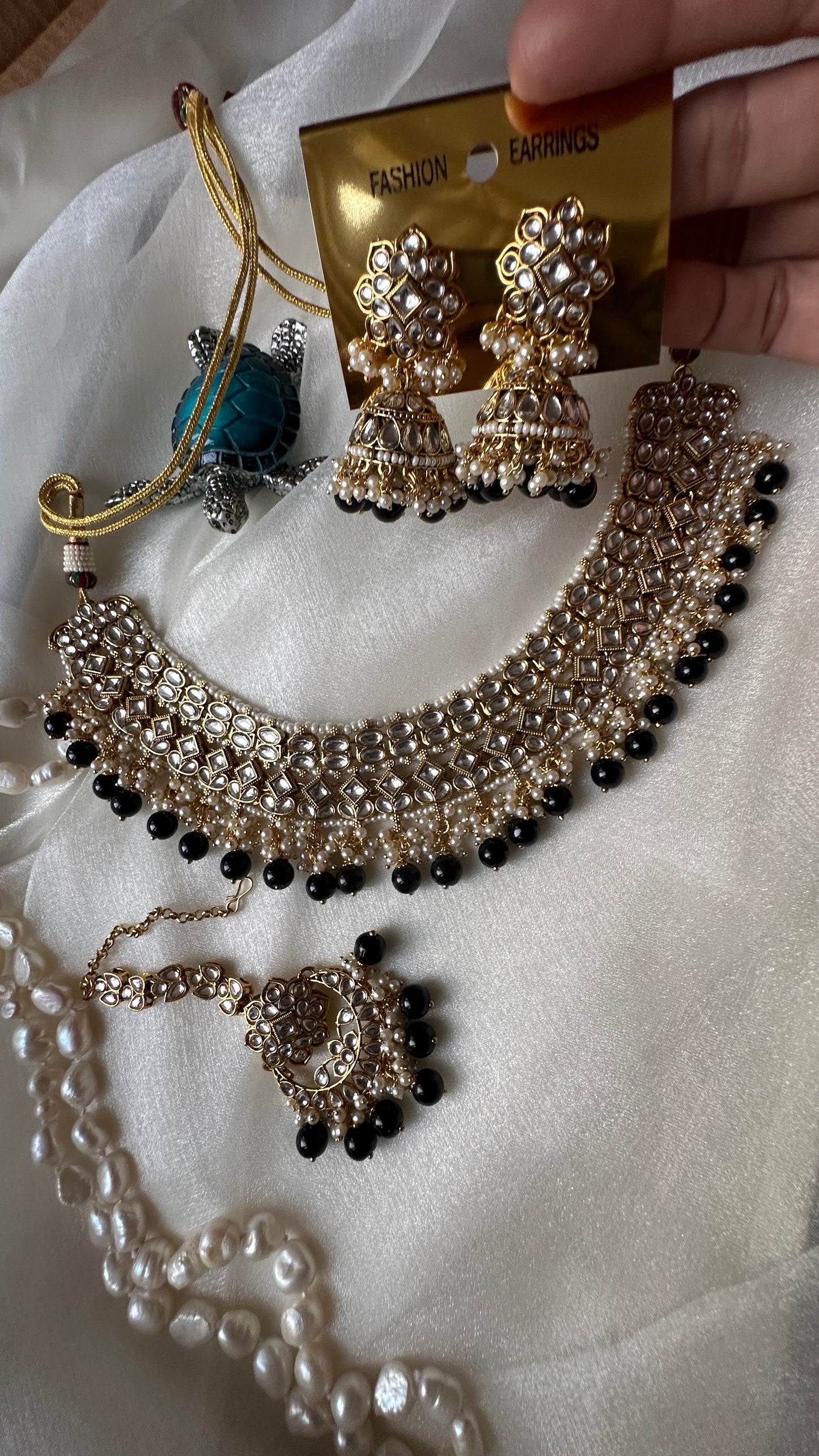 Kundan choker or necklace set with earrings and tikka black