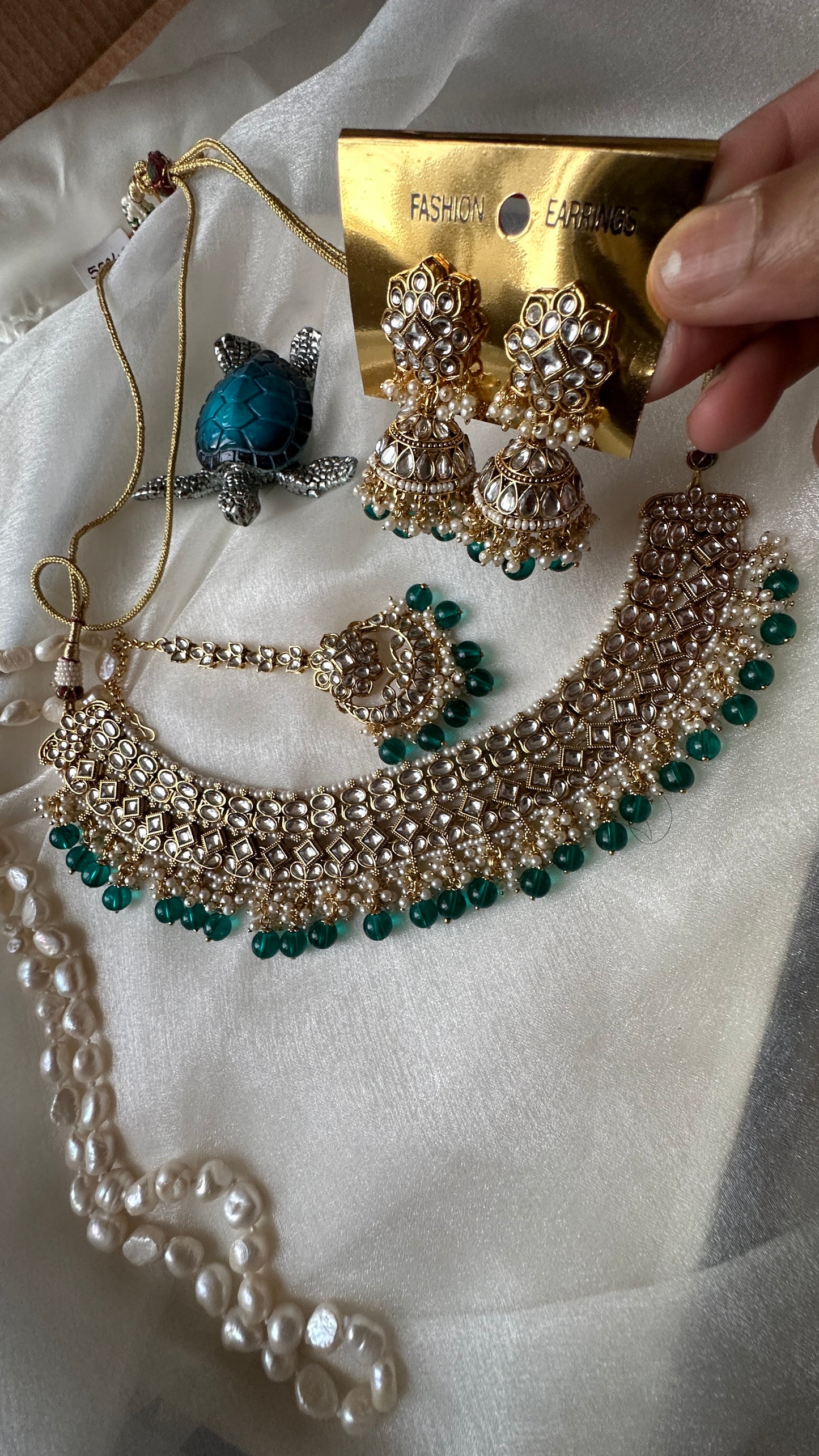 Kundan choker or necklace set with earrings and tikka teal blue