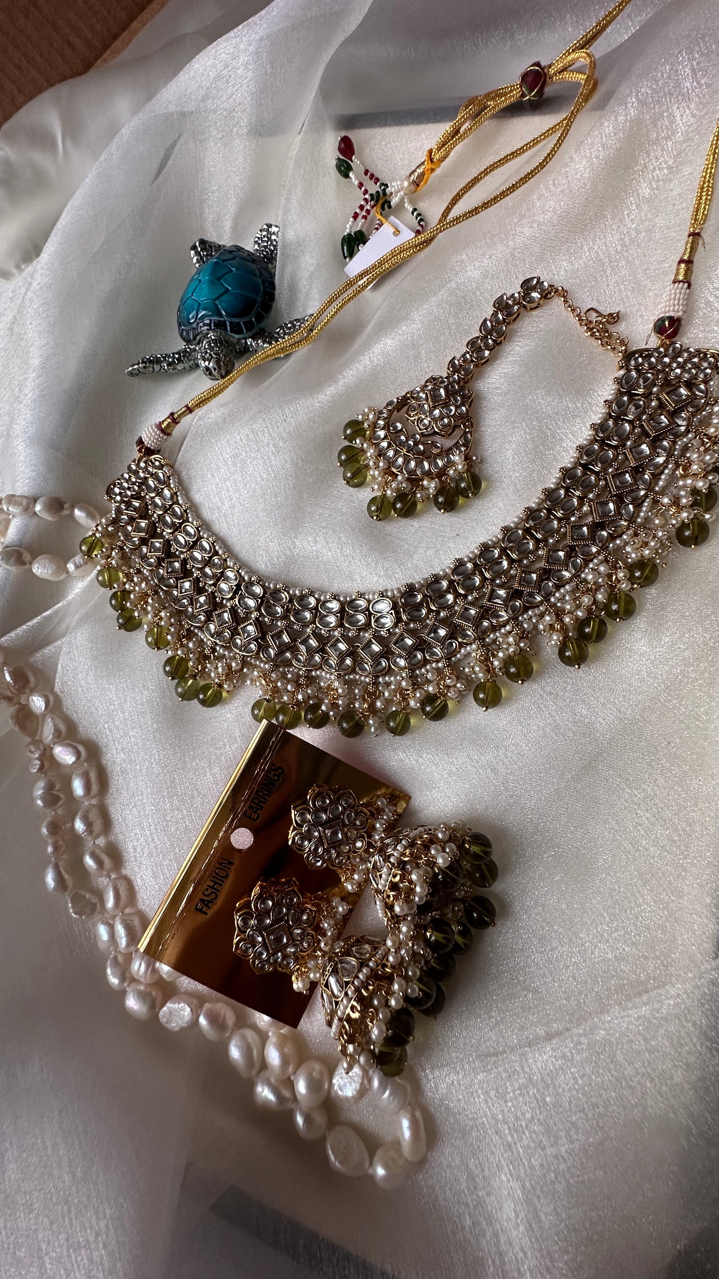 Kundan choker or necklace set with earrings and tikka mehndi green