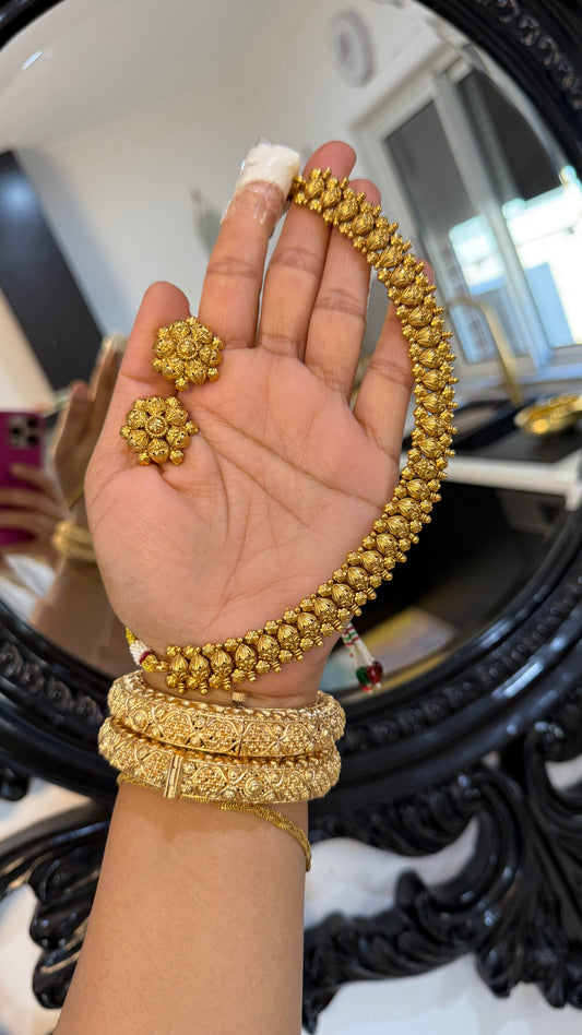 Antique gold-look Indian necklace with Punjabi traditional design, intricate detailing, perfect for bridal jewelry. Includes matching stud, gold-plated for weddings and festive occasions