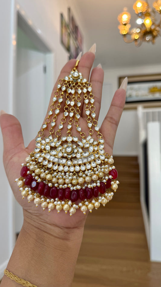 Gold-plated Pachi Kundan Jhumka passa with red and green stones, perfect for bridal and festive occasions