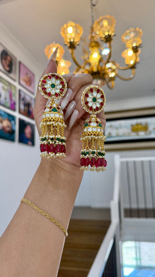 Gold-plated Pachi Kundan Jhumka with red and green stones, perfect for bridal and festive occasions