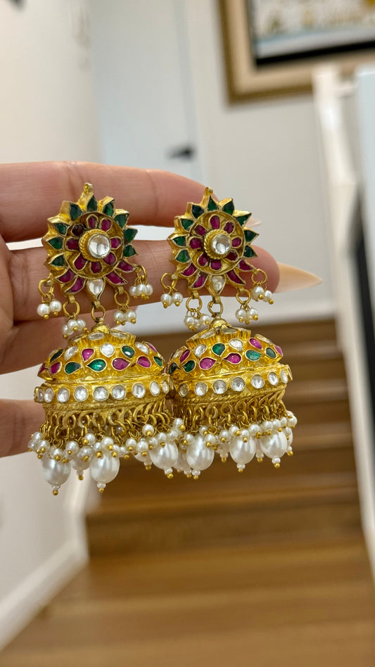 Gold-plated Pachi Kundan Jhumka with red and green stones, perfect for bridal and festive occasions