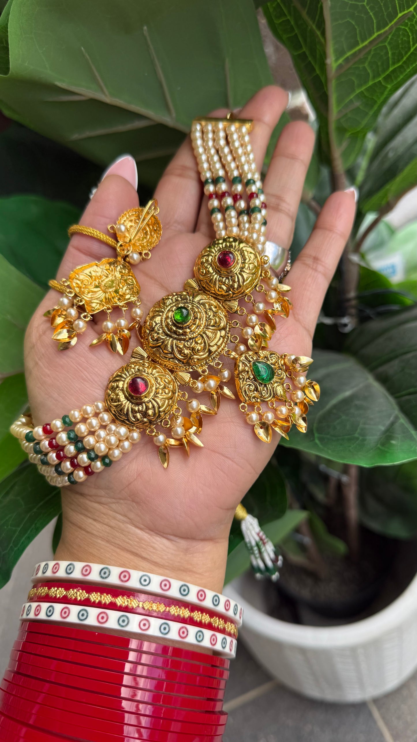 Traditional gold plated choker set with matching earrings and maang tikka for weddings