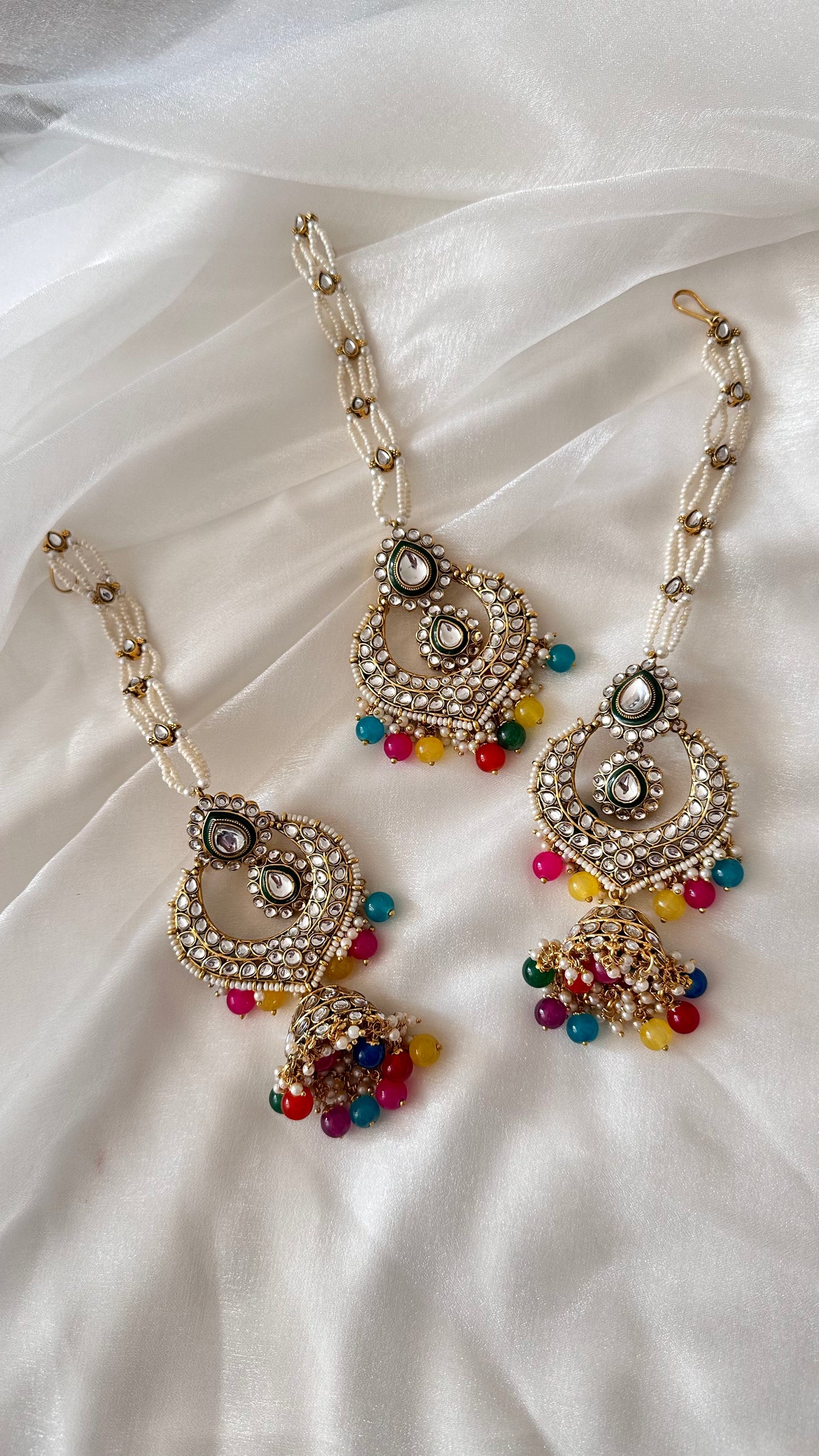 Kundan earrings and tikka with sahare multi