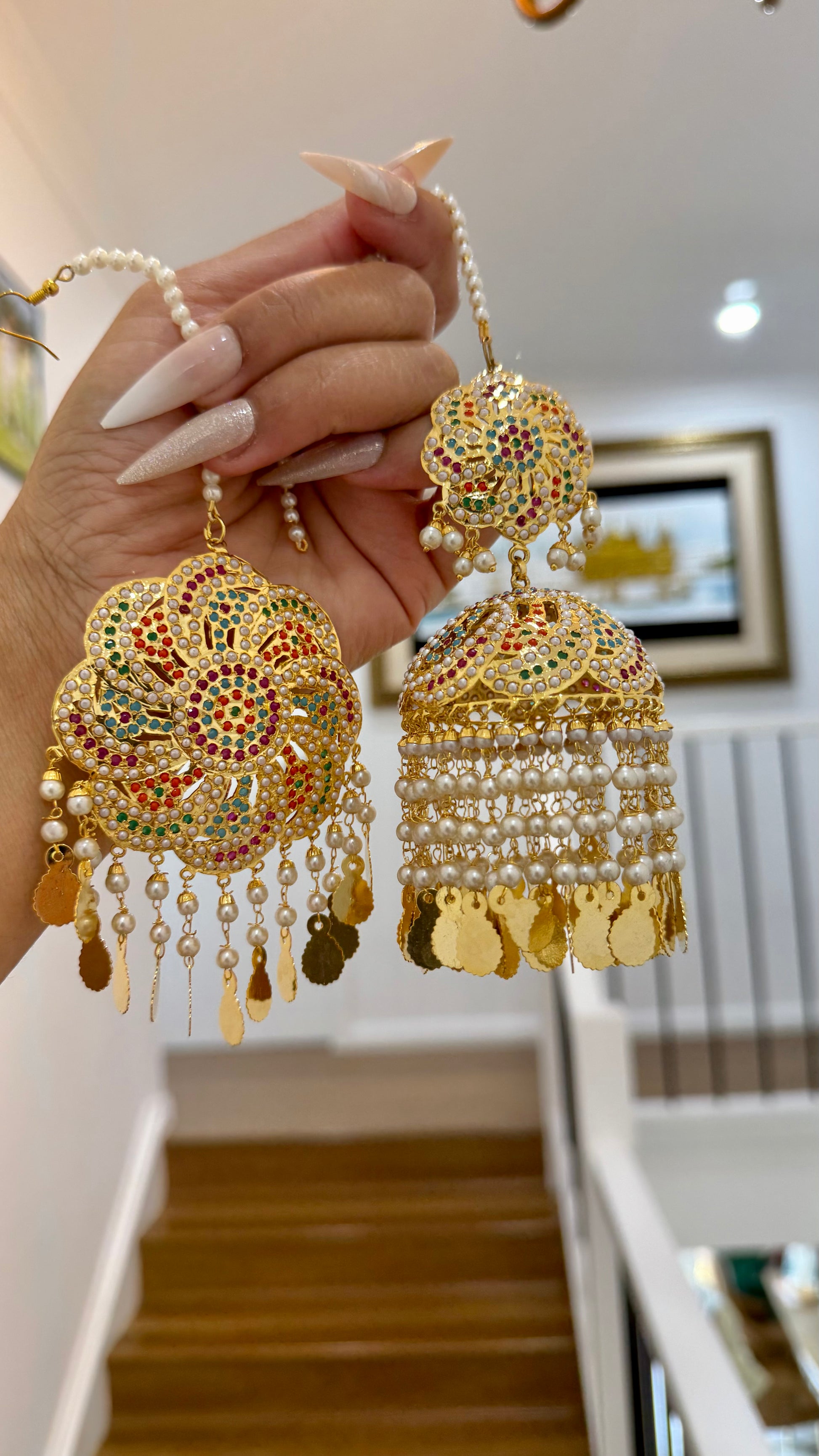 raditional real jadau gold-plated earrings with red and green gemstones