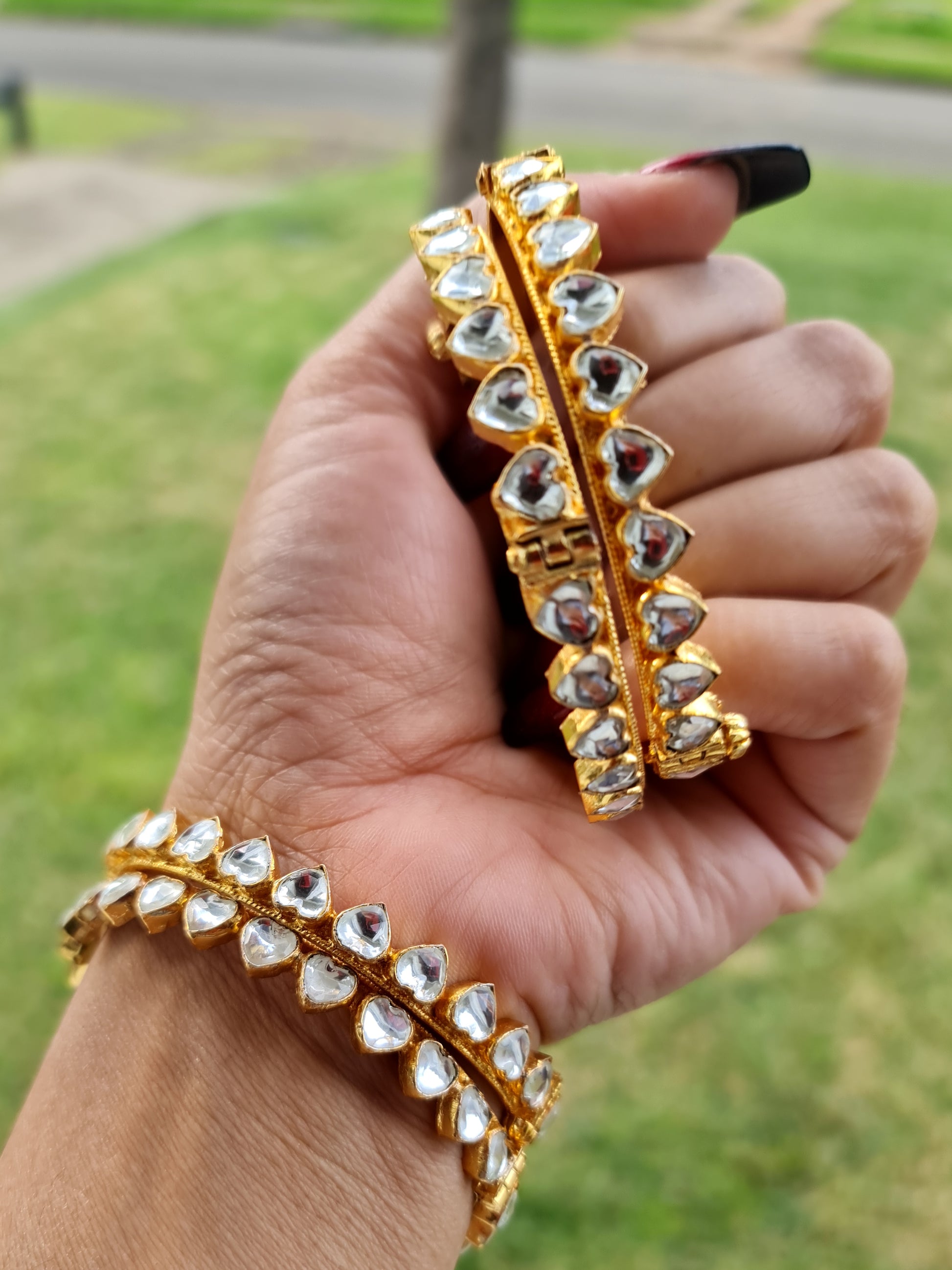 Gold-plated Pachi Kundan kangan bangle with red and green stones, perfect for bridal and festive occasions