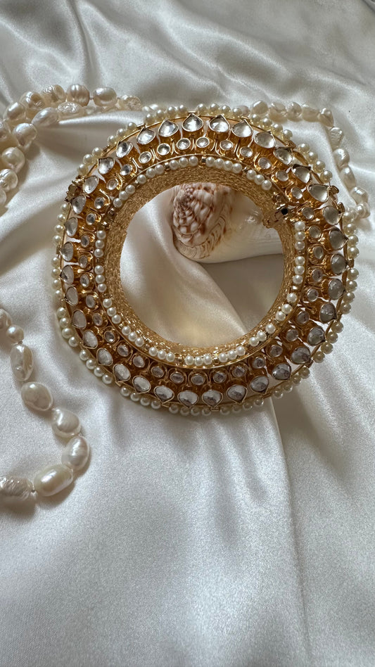 Gold-plated Pachi Kundan kangan bangle with red and green stones, perfect for bridal and festive occasions