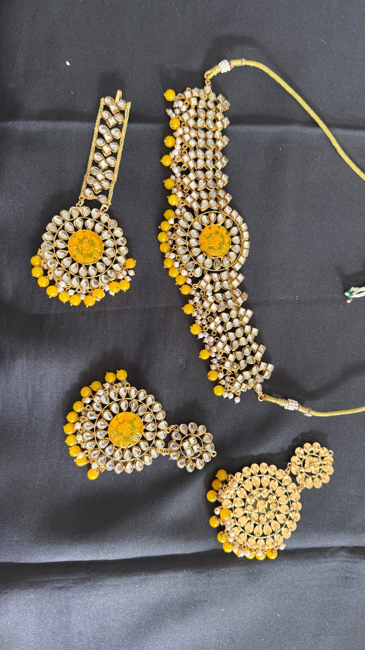 Kundan choker necklace with earrings and tikka yellow