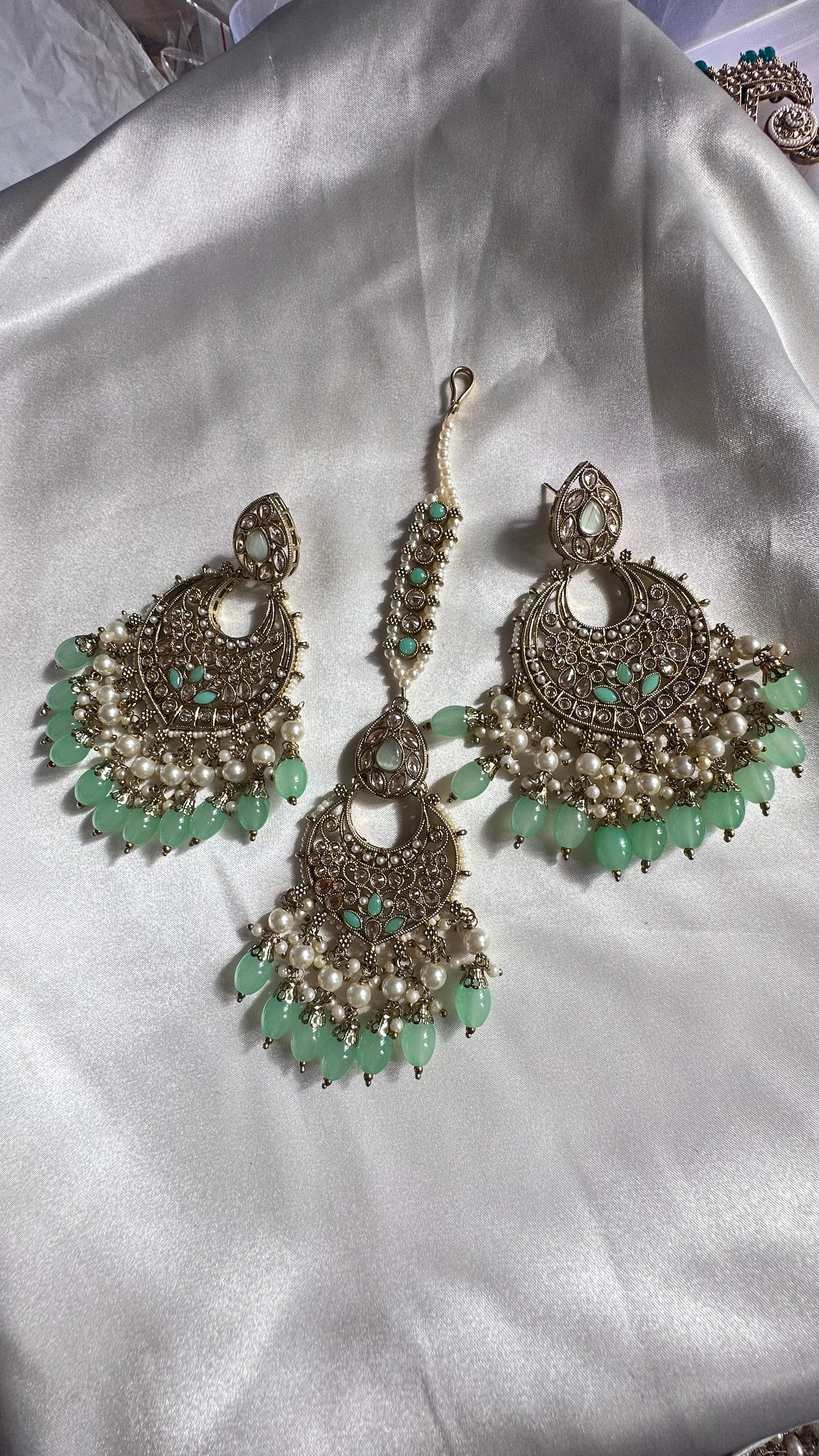 Reverse ad earrings and tikka