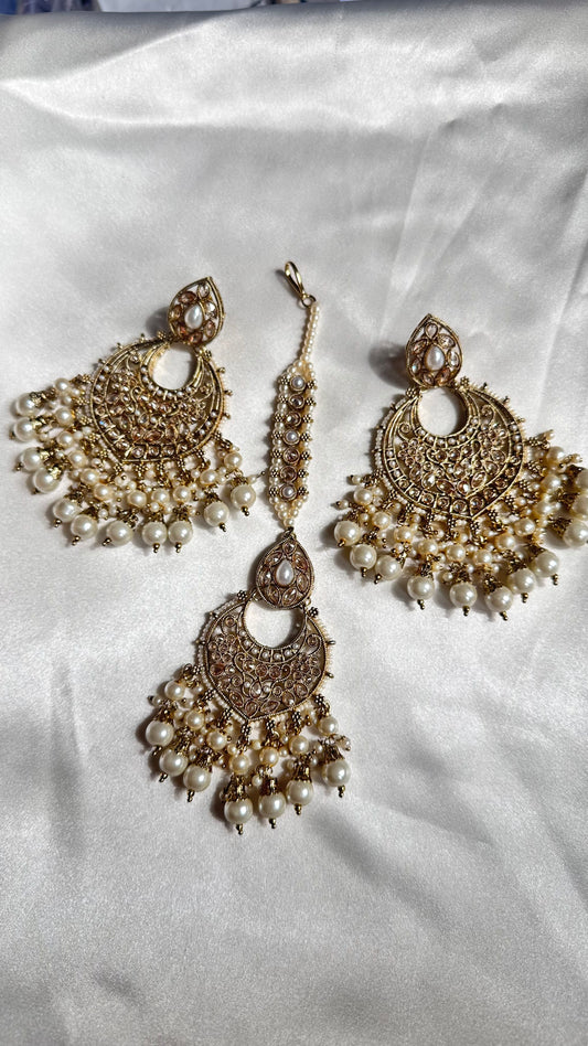 Reverse ad earrings and tikka golden