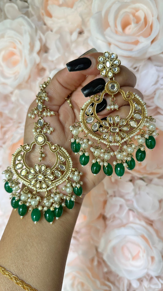 green earrings and tikka in polki kundan