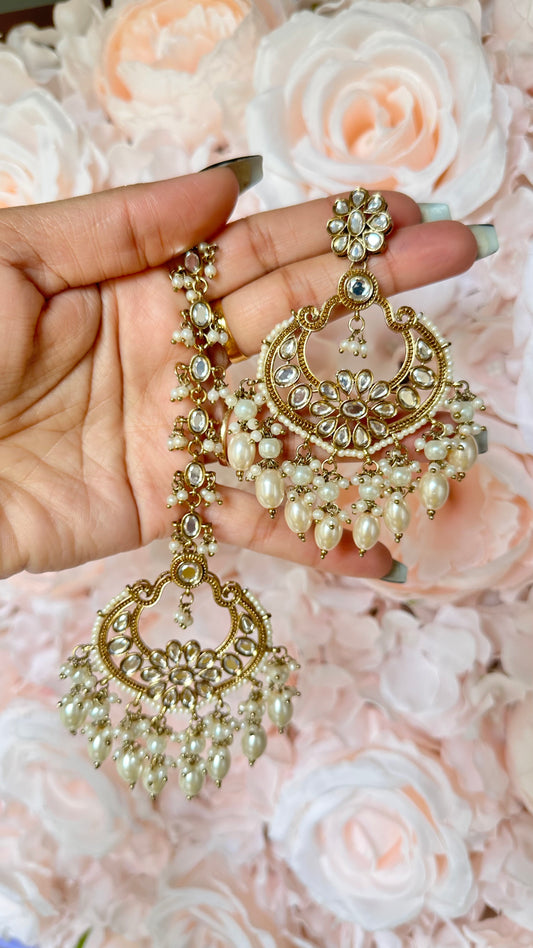 Golden earrings and tikka in polki kundan