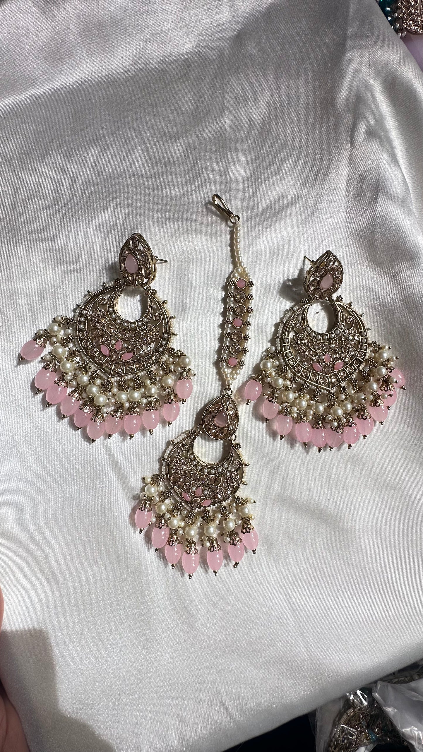 Reverse ad earrings and tikka pink