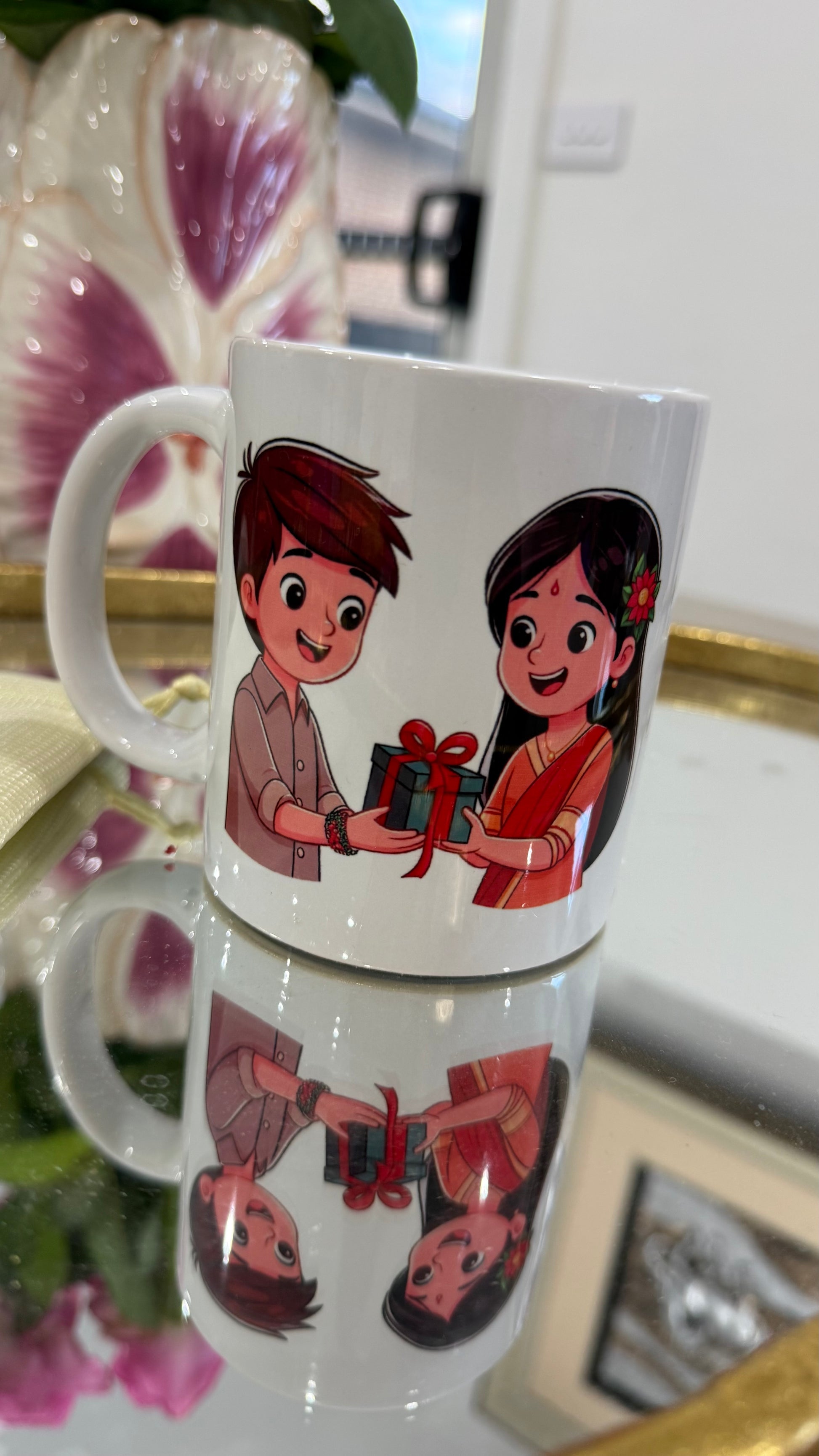 Mug with cartoon design of a Brother Sister holding a gift perfect for rakhi gifts