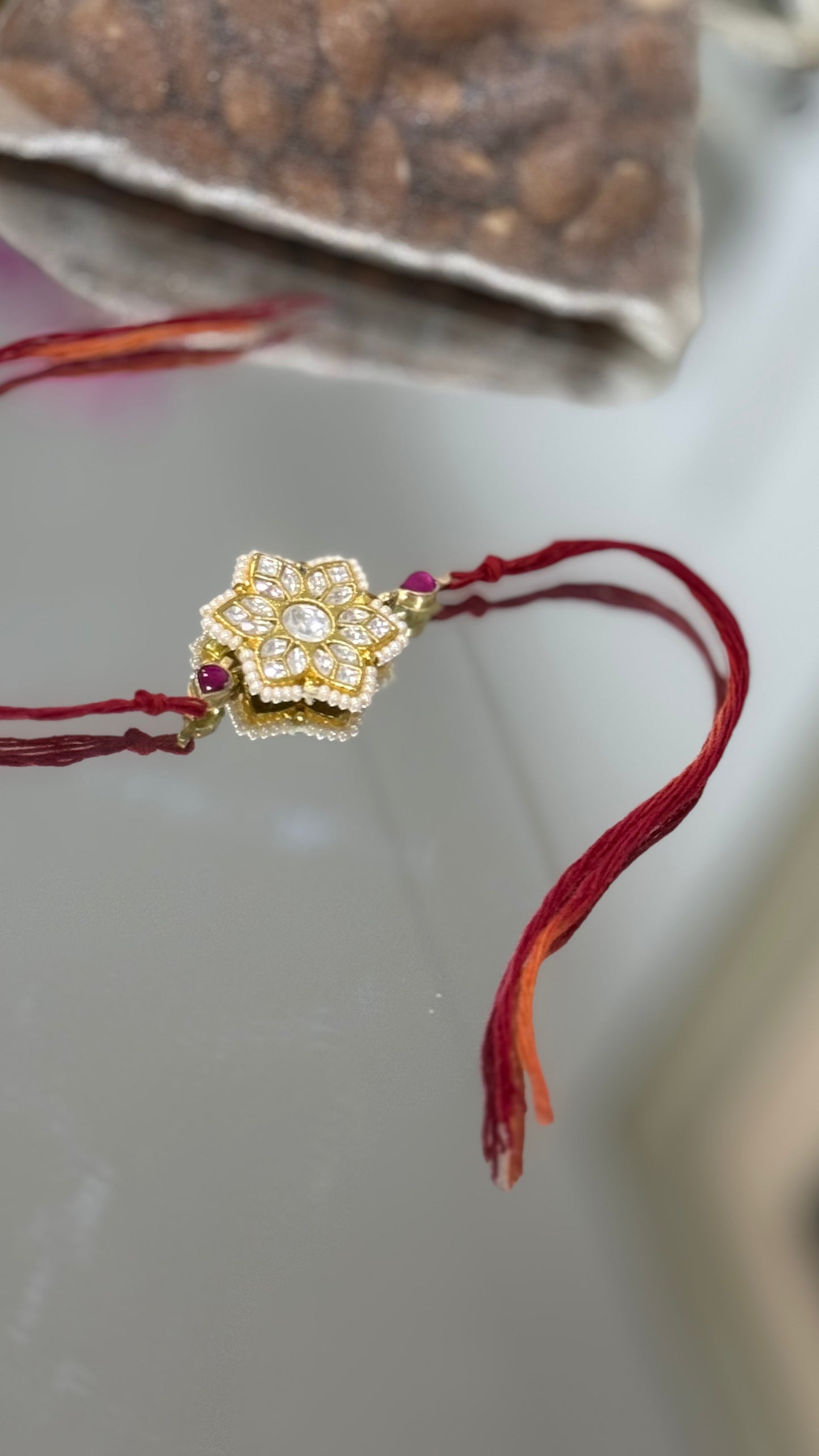 Elegant Pachi Kundan Rakhi with traditional Indian design, available in Australia and worldwide for Raksha Bandhan gifting