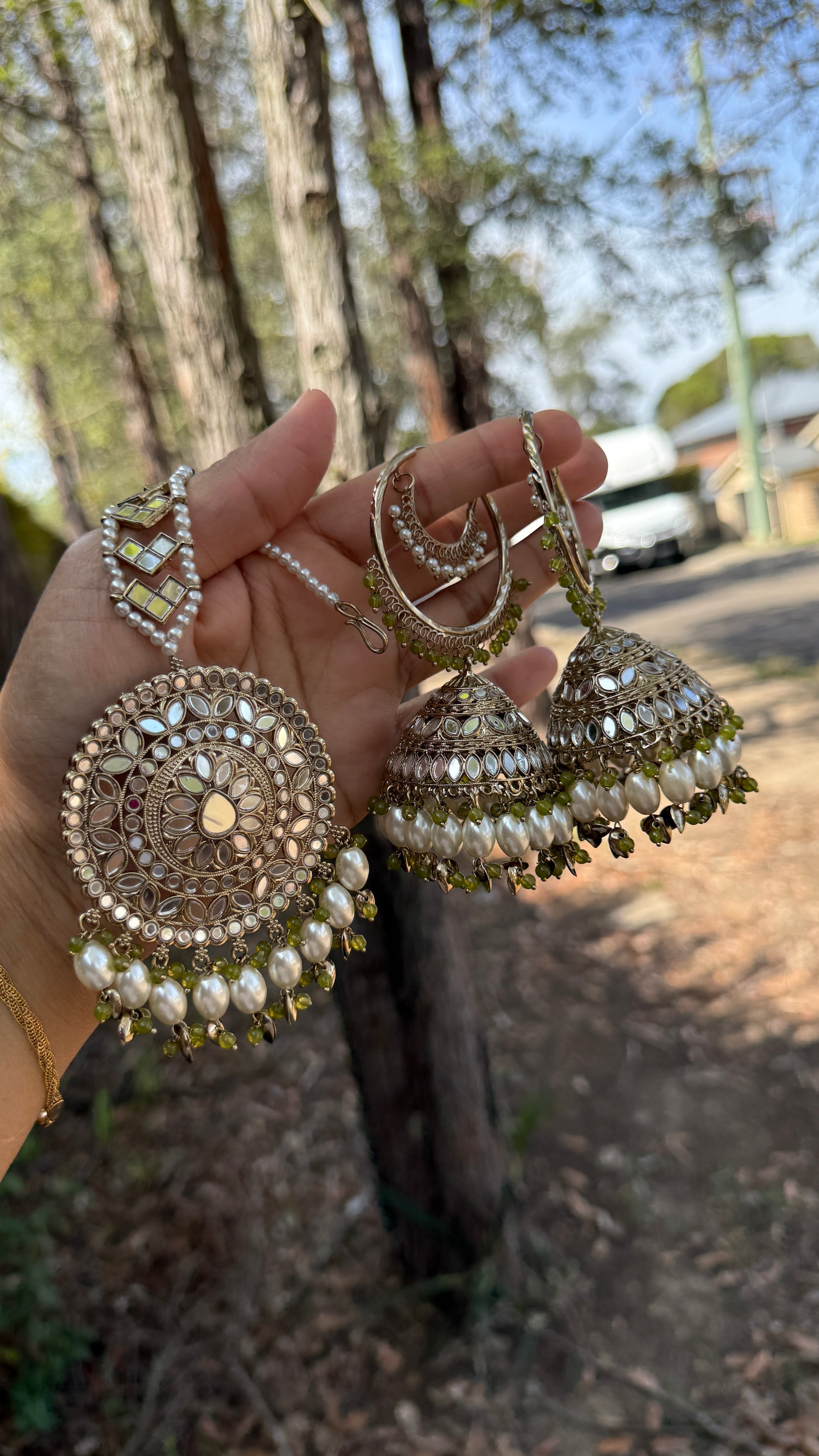 jhumka earrings with matching tikka, adorned with mirrors and intricate detailing, ideal for bridal and cultural events or casual party wear