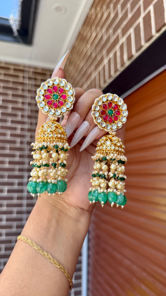 Gold-plated Pachi Kundan Jhumka with red and green stones, perfect for bridal and festive occasions