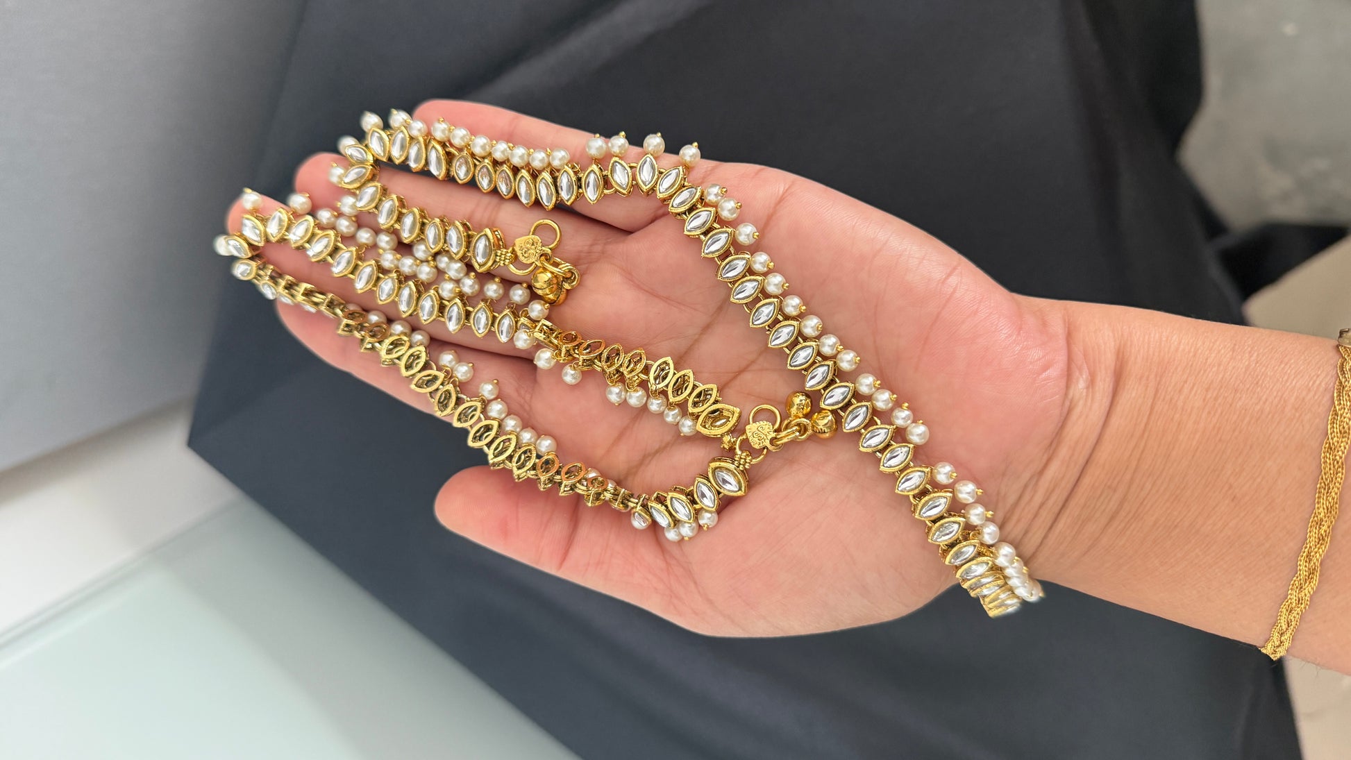 Traditional Indian anklet with intricate gold look design, adorned with bells and beads, ideal for weddings and festive occasions, Kundan anklet. Polki anklet. Bridal anklet