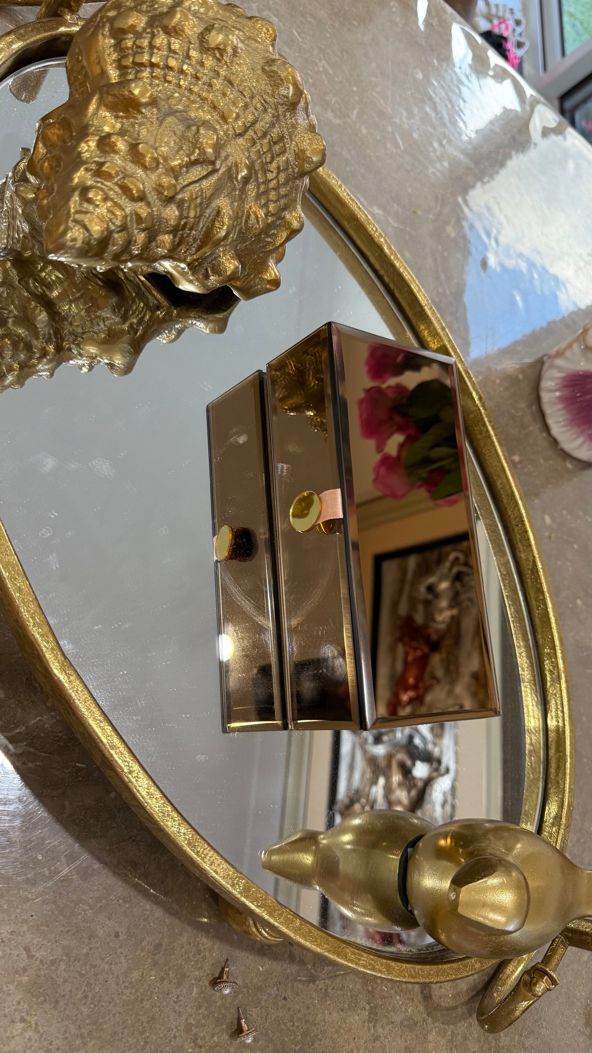 Decorative gold mirror with intricate designs on a reflective surface Perfect for Gifts Rakhi store jewellery or Cash