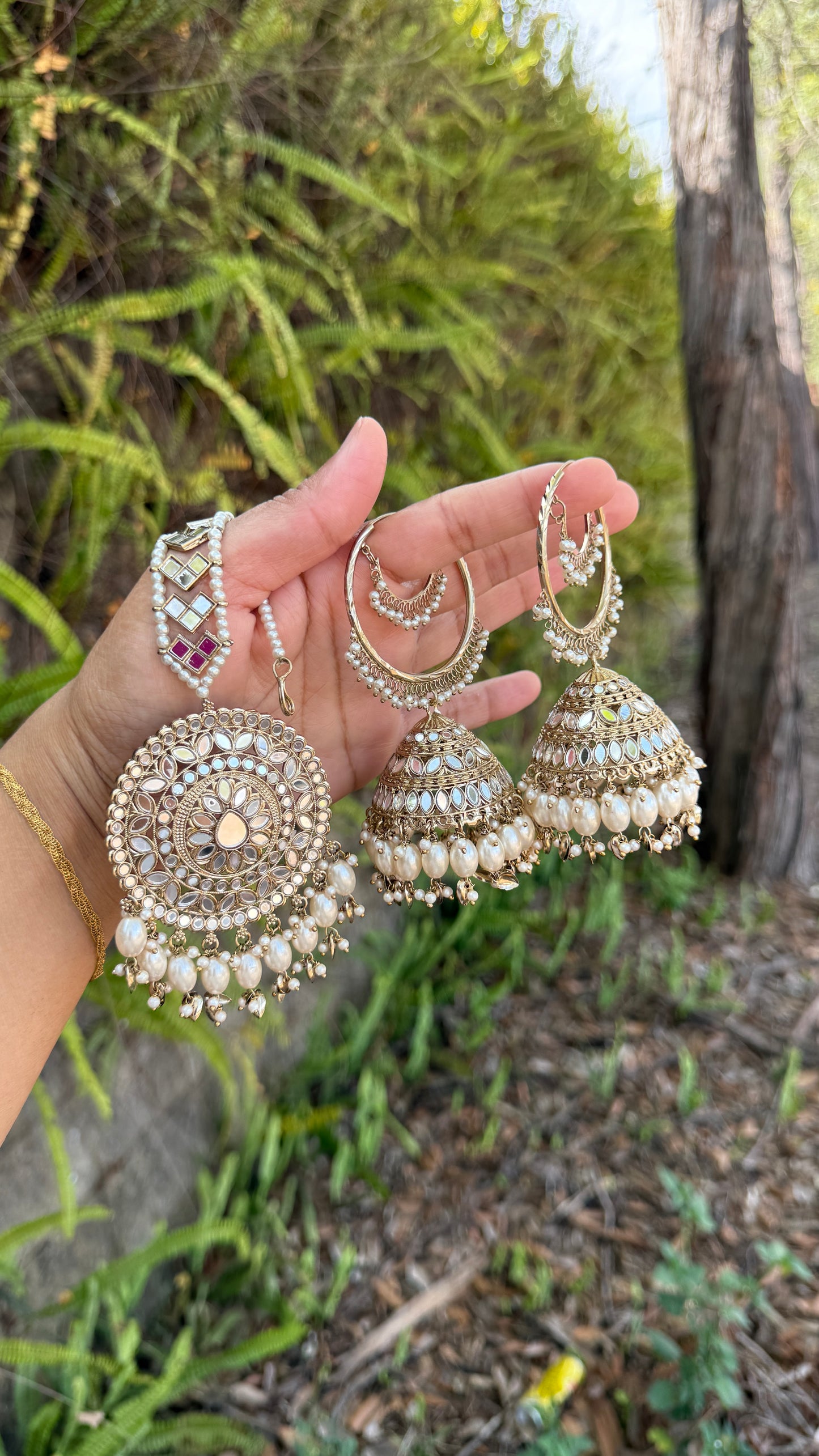 jhumka earrings with matching tikka, adorned with mirrors and intricate detailing, ideal for bridal and cultural events or casual party wear