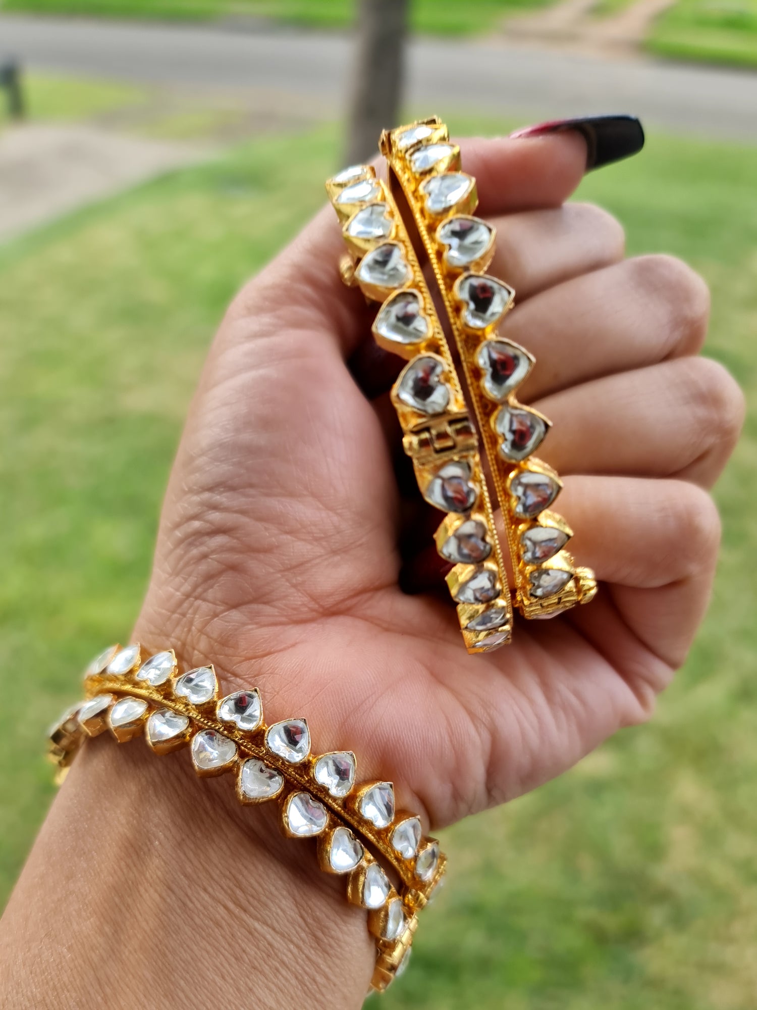 Gold-plated Pachi Kundan kangan bangle with red and green stones, perfect for bridal and festive occasions