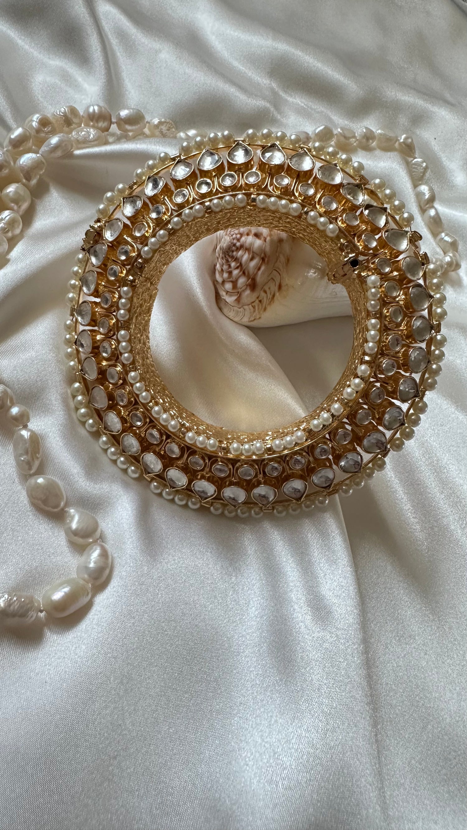 Gold-plated Pachi Kundan kangan bangle with red and green stones, perfect for bridal and festive occasions